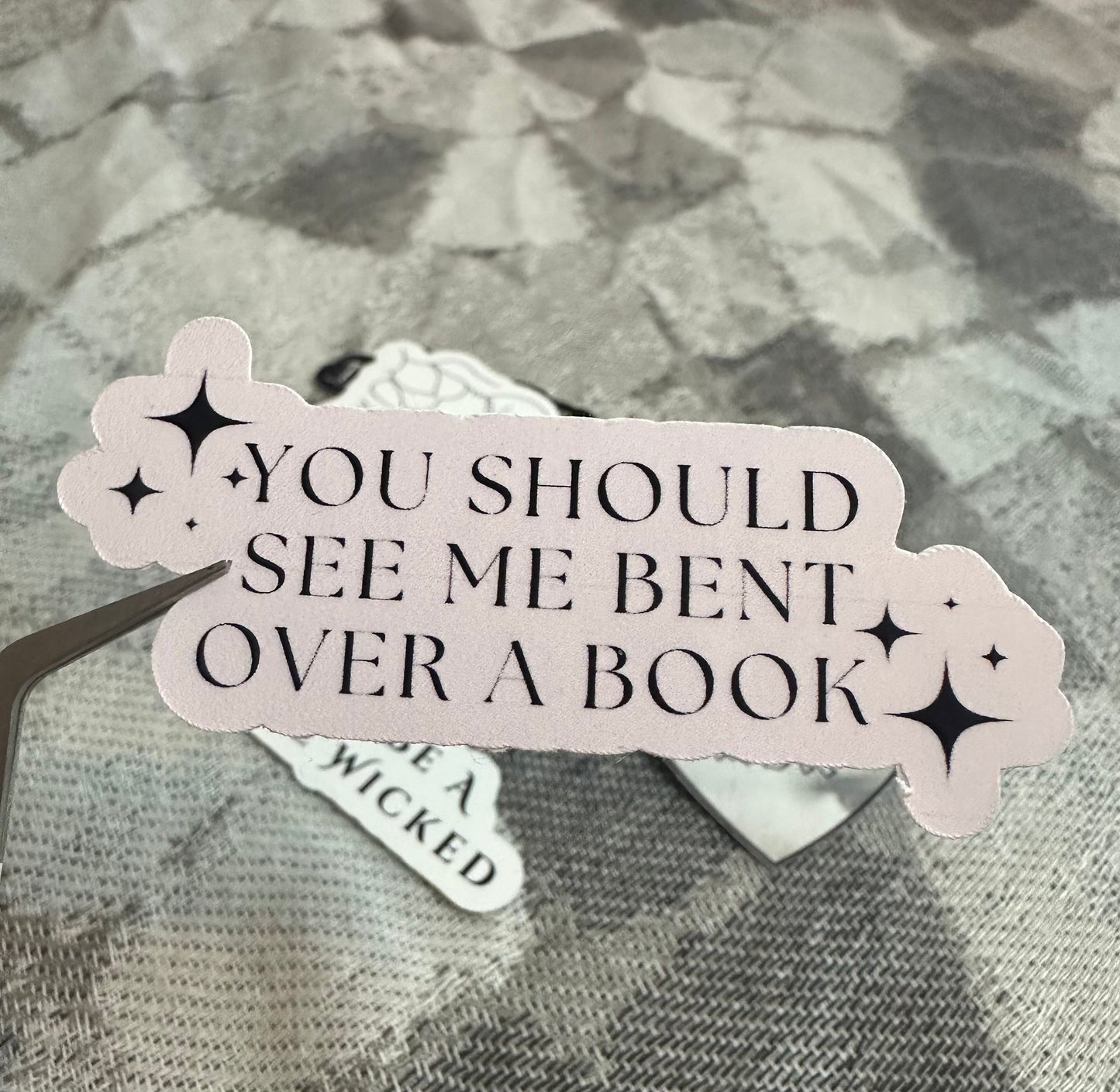 Bent Over A Book Sticker